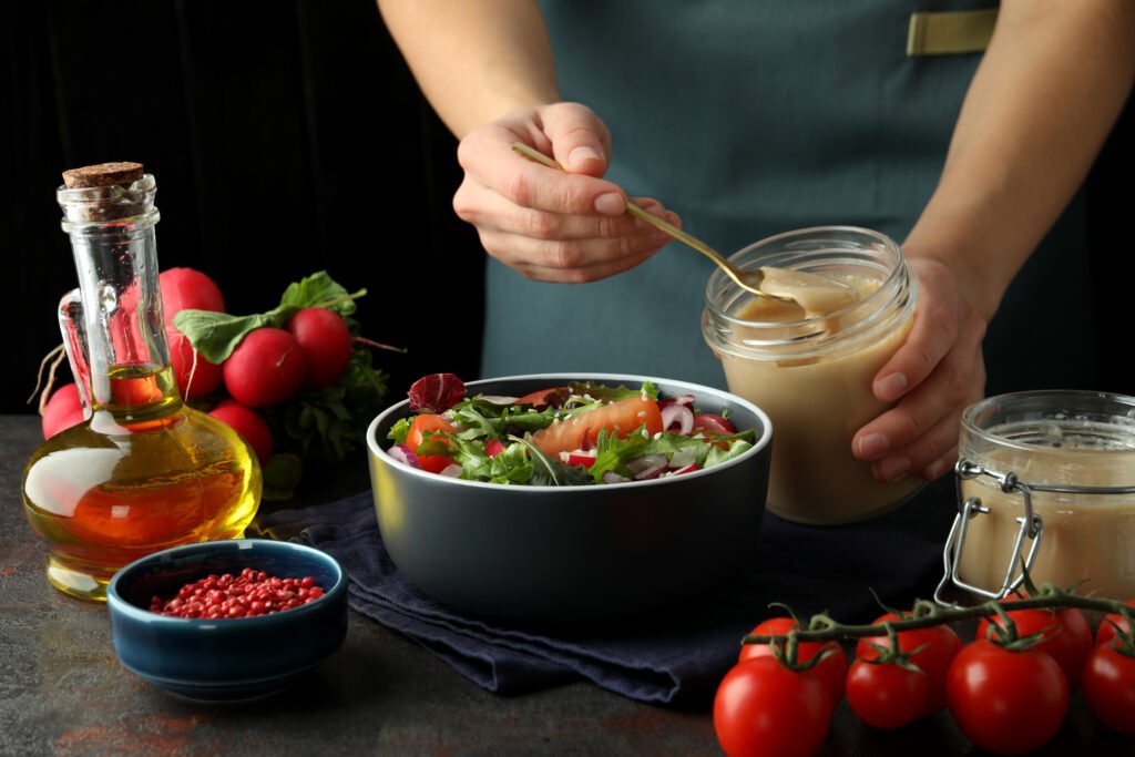 concept cooking vegetable salad with tahini sauce dark textured table