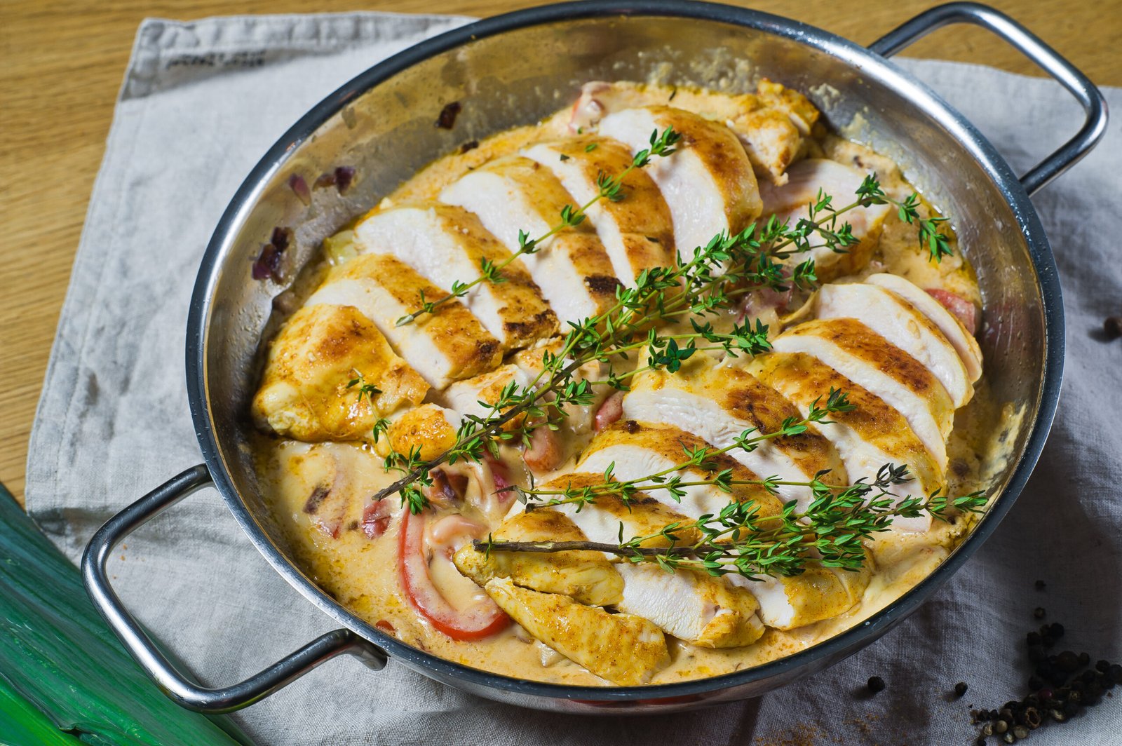 frying pan with baked sliced chicken breasts scaled TikTok Chicken Cobbler Recipe - Quick & Easy Weeknight Dinner