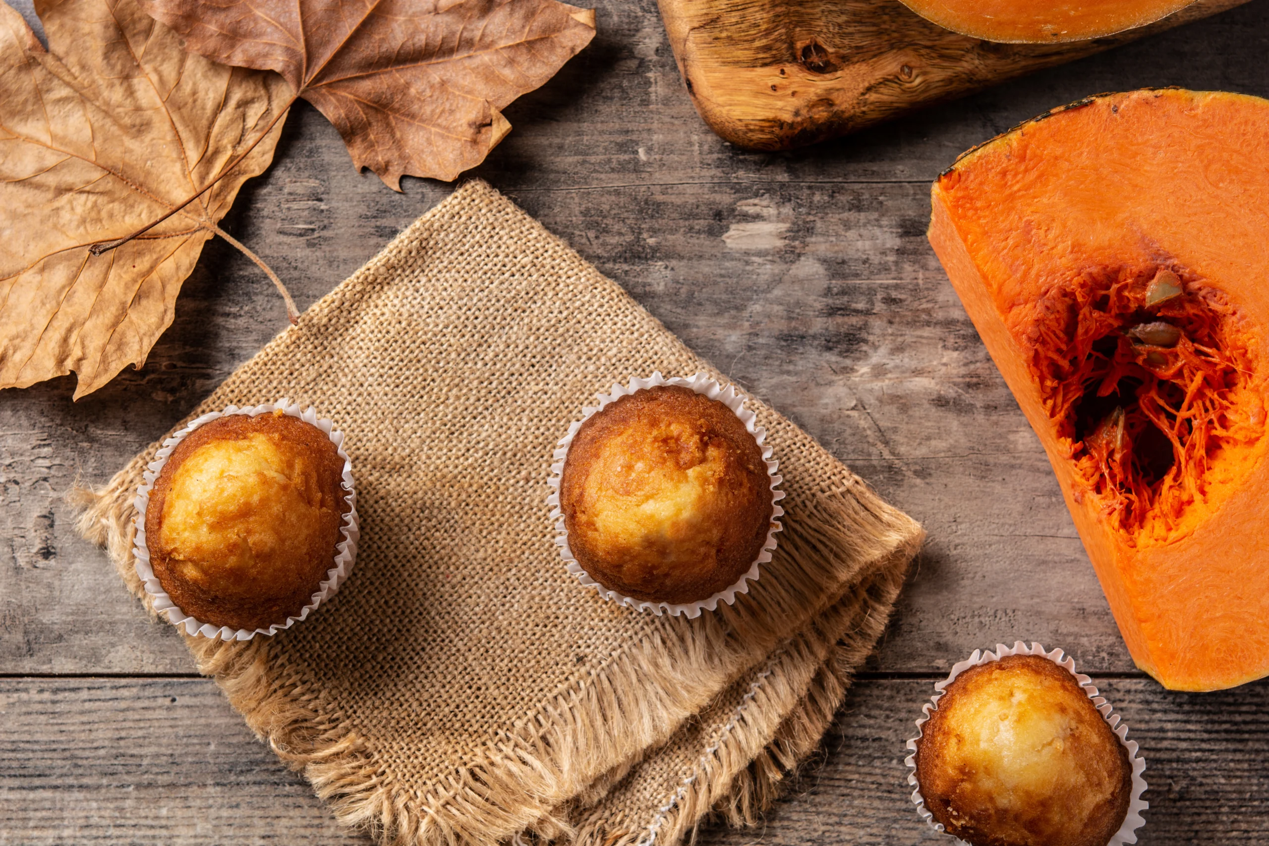 pumpkin muffins wooden table scaled Pumpkin Muffin Recipe Two Ingredients: Easy & Delicious Guide
