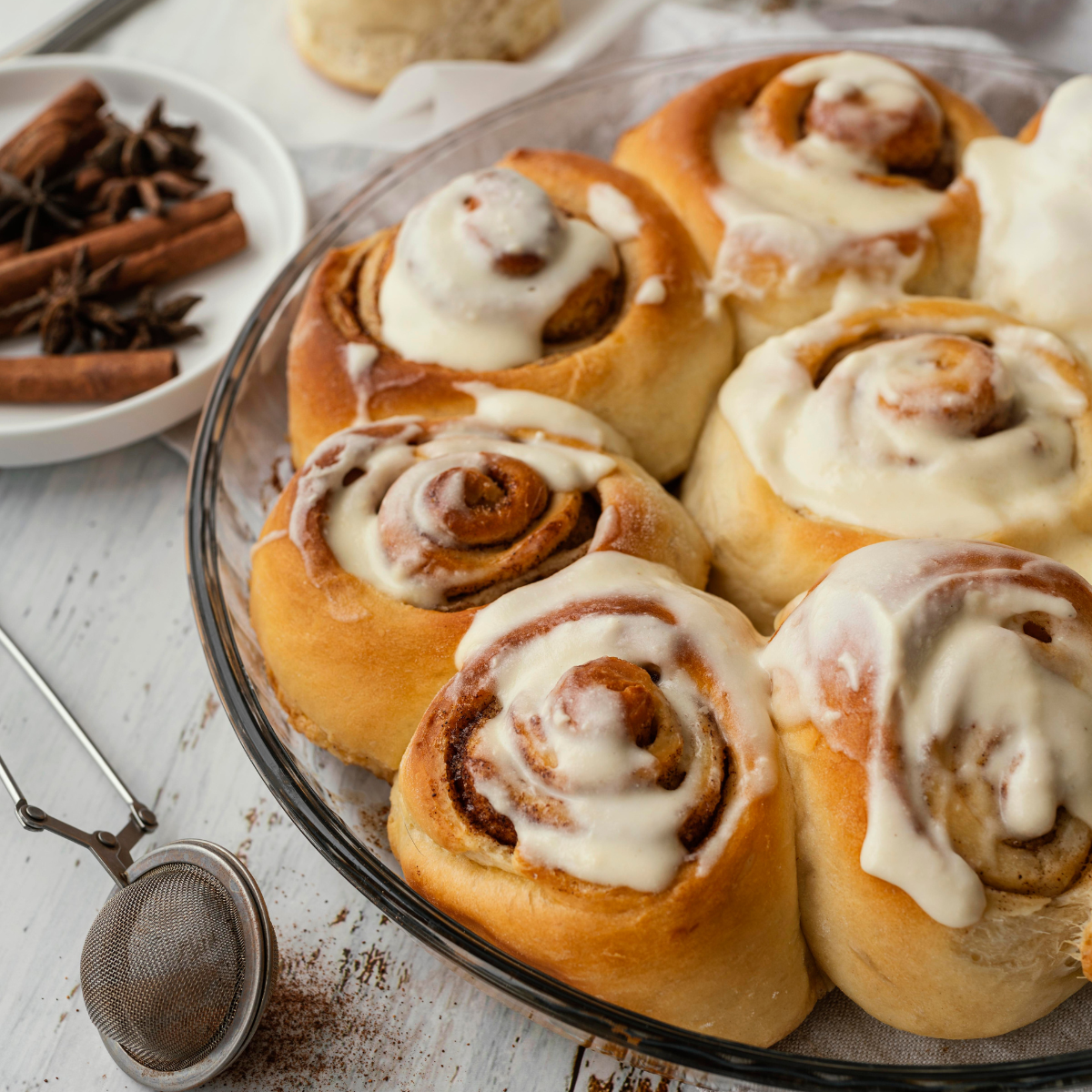 cinnamon rolls with cream high angle Cinnamon Roll Icing Recipe: Tips, Variations & FAQs