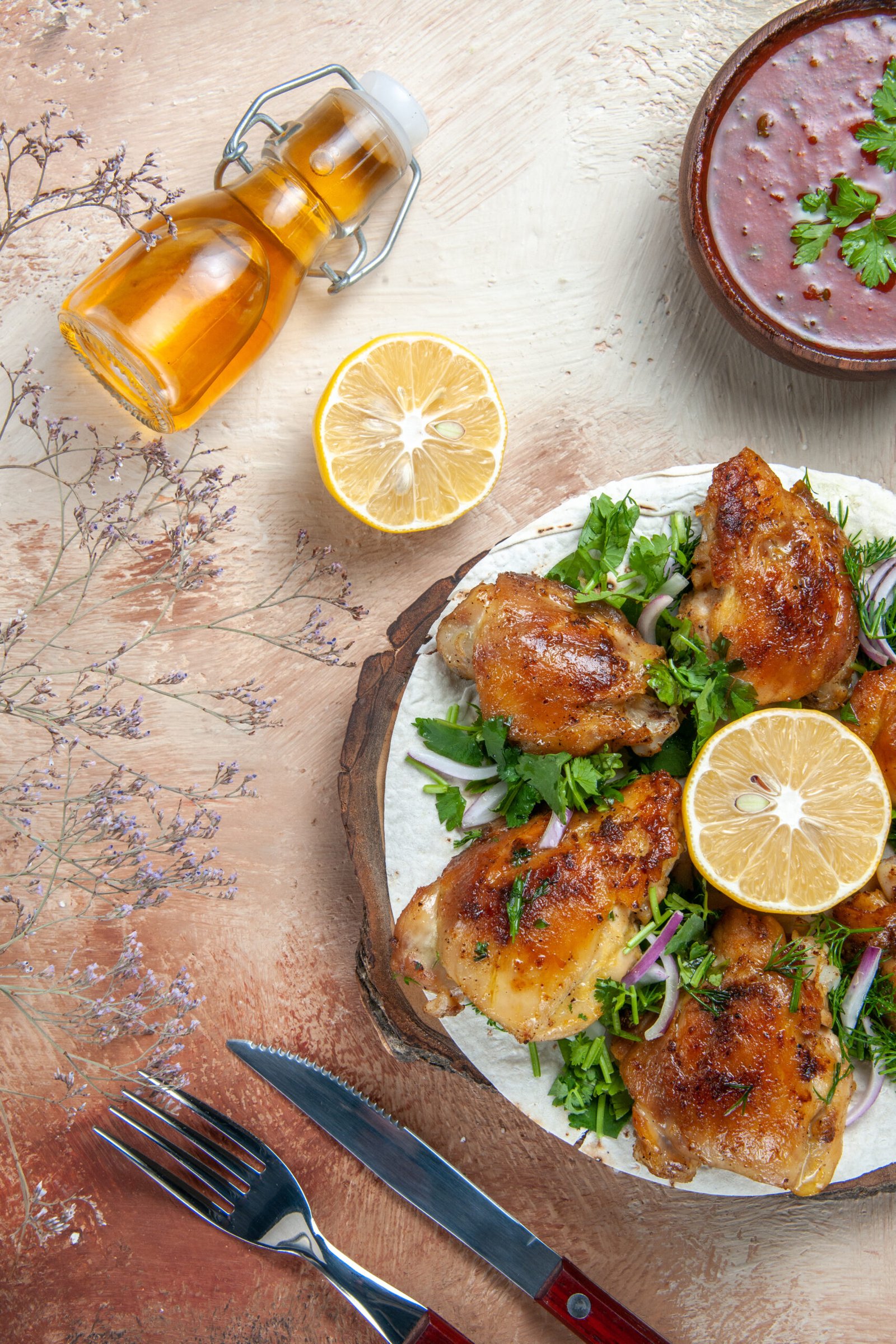 top view chicken garlic bottle oil lemon sauce chicken with herbs lavash fork knife scaled Soul Food Sunday Dinner Ideas - Recipes and Traditions