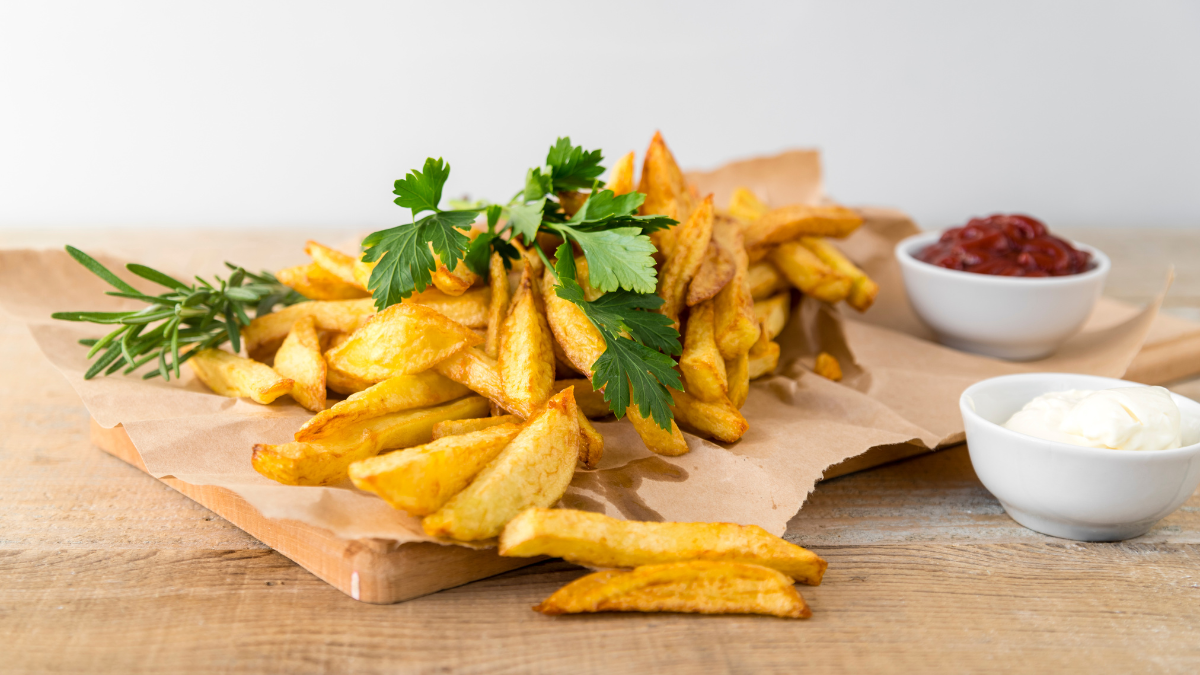 Assorted nacho fries loaded with different toppings like cheese jalapenos and sour cream perfect for a customization guide 2 Are Taco Bell Nacho Fries Vegan?