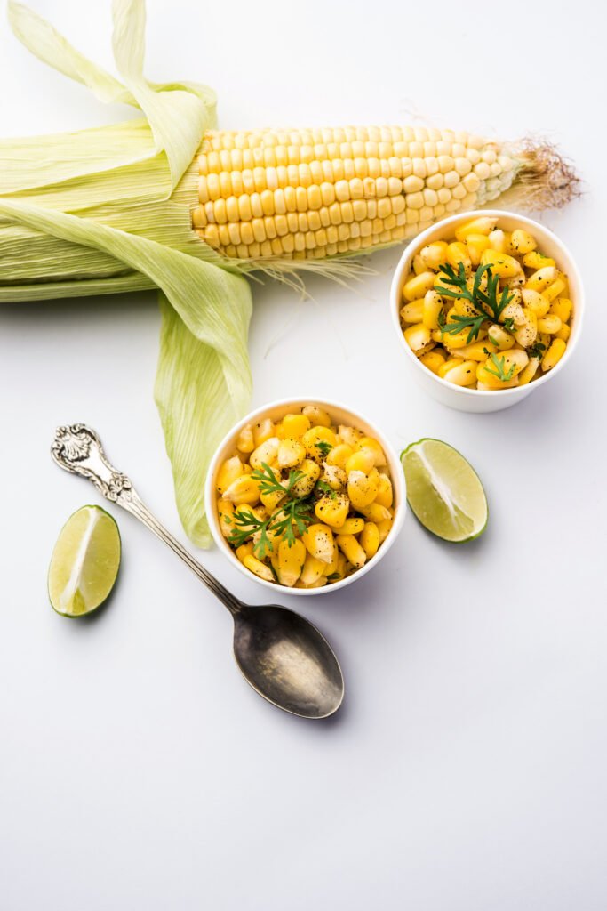 Spicy Masala Sweet Corn is a tasty roadside Indian snack, which is very easy to make. selective focus