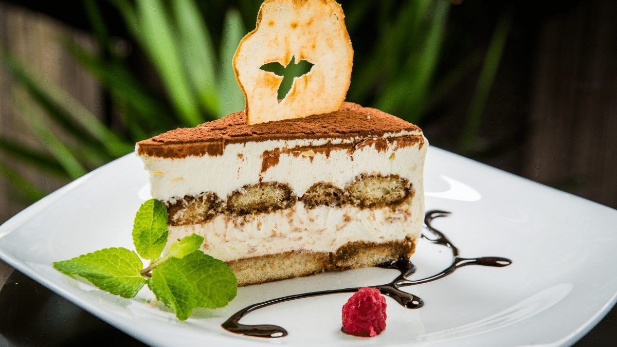 tiramisu cake plate serve with berries 26 Ultimate Guide to Tiramisu Cheesecake: Recipes, Tips, and FAQs