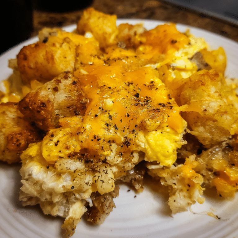 Crockpot Tater Tot Breakfast Casserole cooks tots, sausage, and eggs slowly for a warm, hearty breakfast dish.