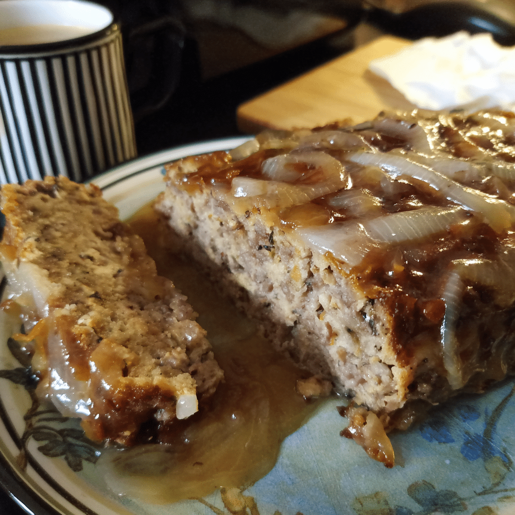 French Onion Meatloaf with Caramelized Onion Gravy blends beef with rich onion sauce into a comforting dinner.