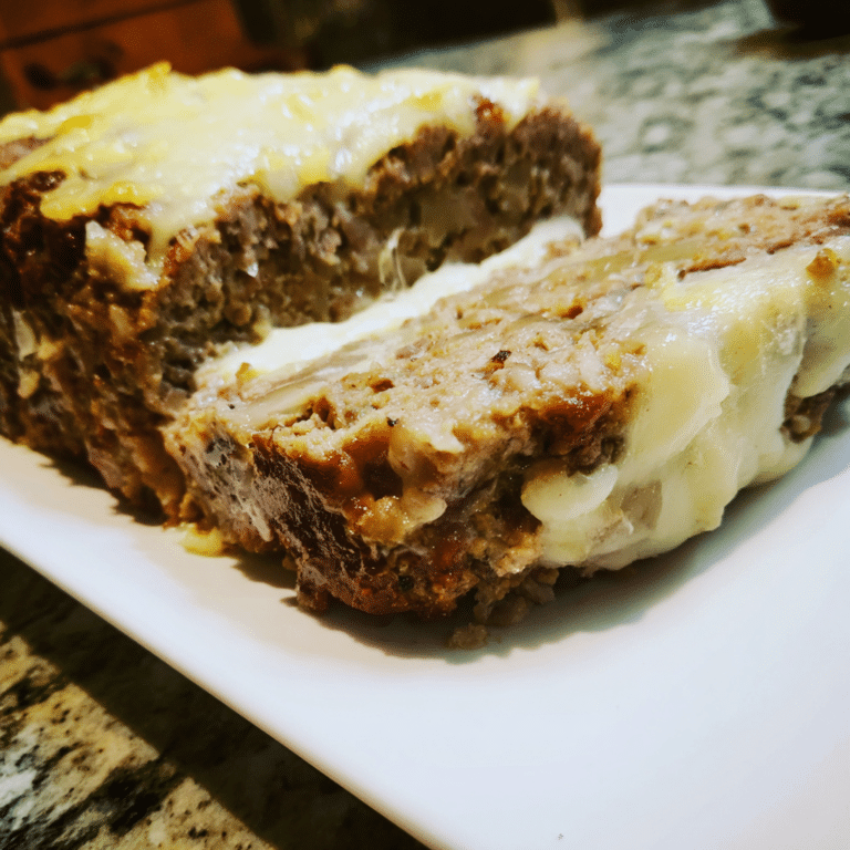 French Onion Meatloaf with Swiss Cheese Topping layers beef, onions, and cheese for a savory, hearty variation.
