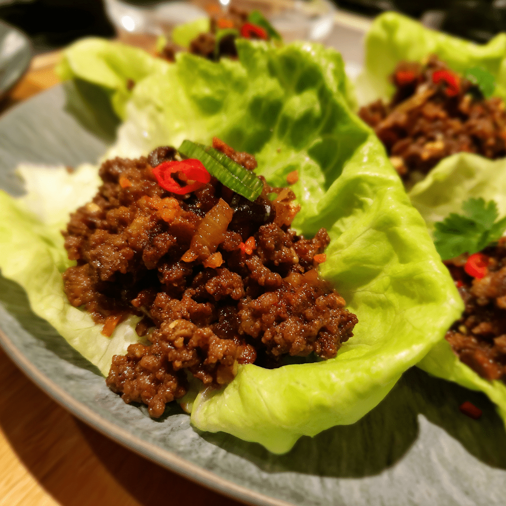 Spicy Szechuan Ground Beef Lettuce Wraps pair bold, spicy beef with crisp lettuce for a light yet flavorful meal.